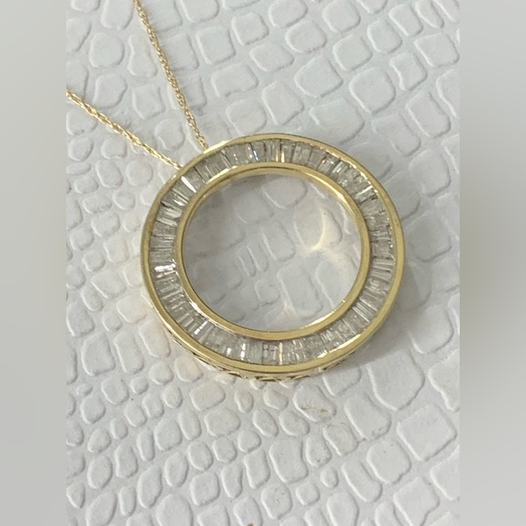 10K YELLOW GOLDCIRCLE OF LIFE DIAMOAND PENDANT WITH 16 .1/2” CHAIN.